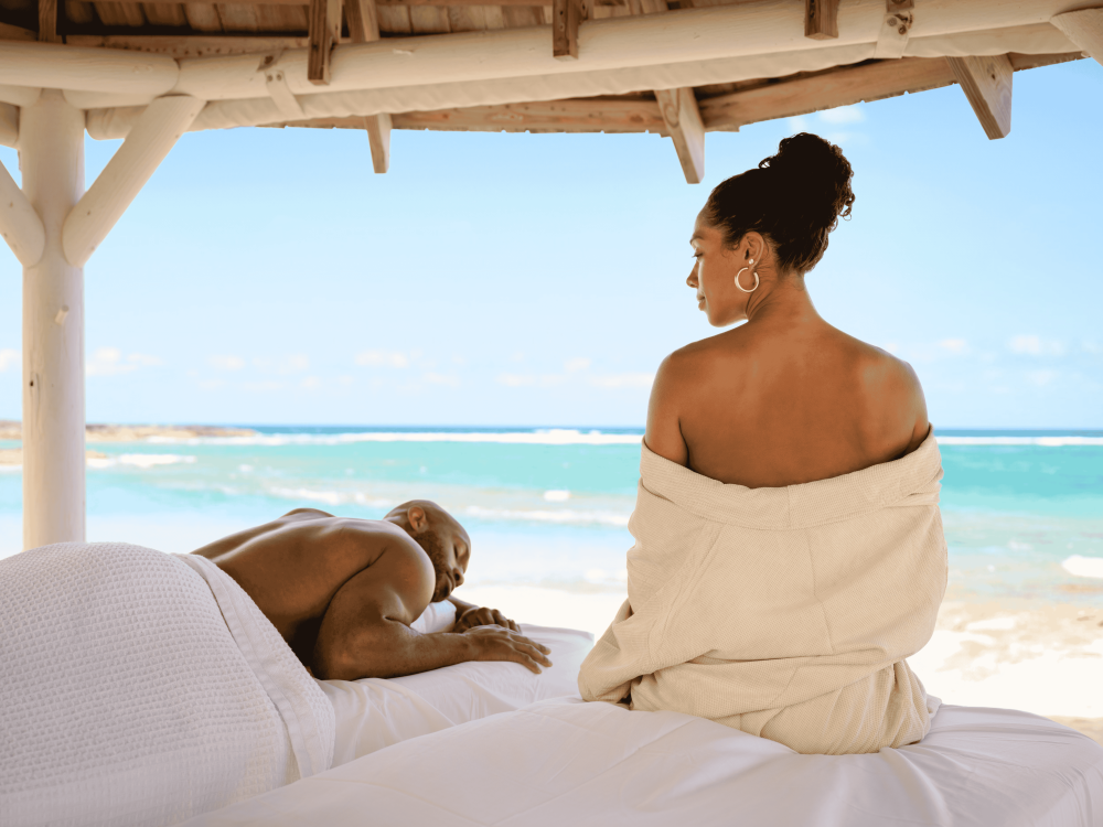couple getting a beach side massage 